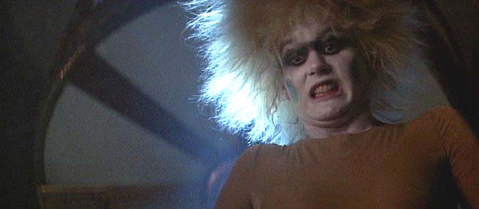 Figure 30: This time, it is mime­faced Pris in Blade Runner that has Deckard at her mercy and between her thighs.